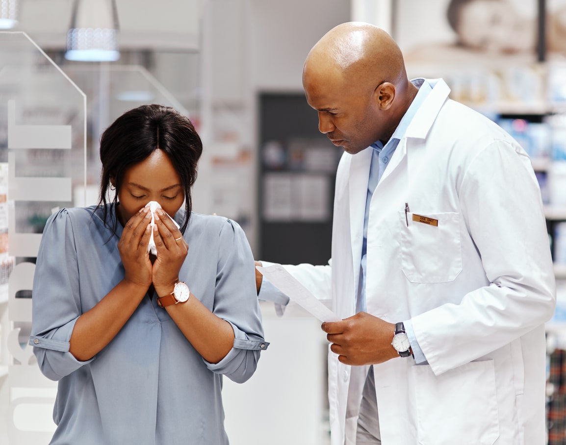 Woman with sinus exam at ENT office with doctor