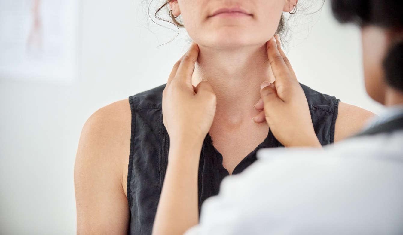 ENT specialist conducting a throat exam