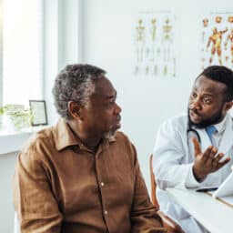 Man meeting with an ENT doctor.