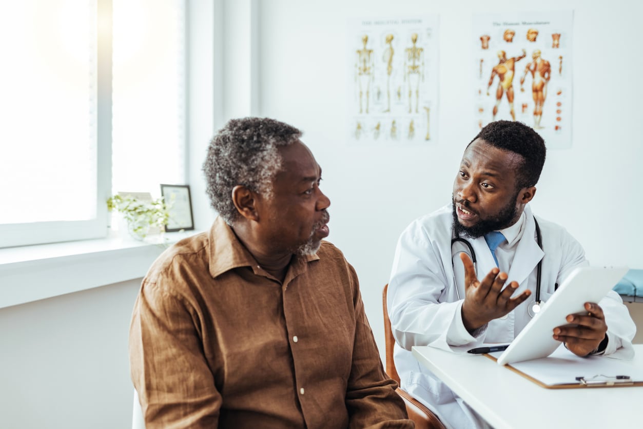 Man meeting with an ENT doctor.